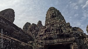 The Bayon Temple at Angkor, showcasing its iconic stone faces and intricate carvings. Check the gallery for similar footages.