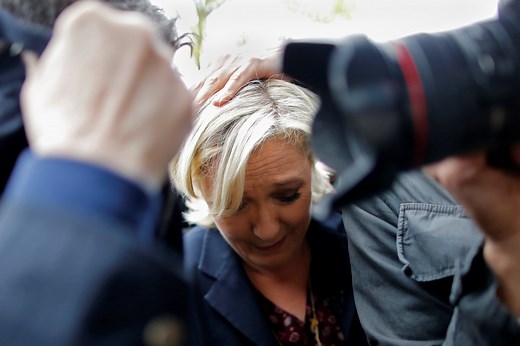 Protesters shout 'out with fascists’ and hurl eggs at French far-right presidential candidate Marine Le Pen during a campaign stop three days before the election. | The Guardian
