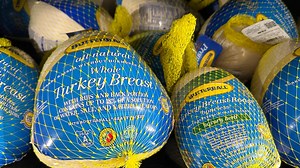 Grocery chains vie for a place on Thanksgiving tables with turkey dinner deals and store brands