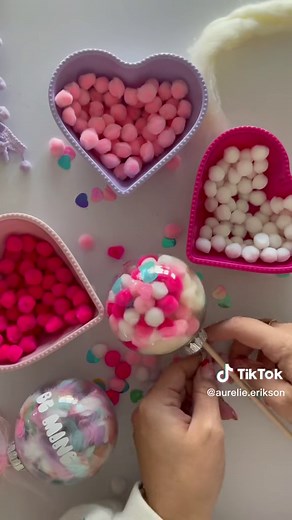 A fun Valentine craft even the kids can do. All you need is some plastic ornaments, a wooden dowel , yarn, pompoms and glitter or confetti. Happy crafting 💕 #valentinediy #kidscrafts #valentinesdiy #fyp