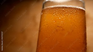 A glass of cold beer. Drinking beer. Making drinks. Party time. Beer glass. A beautiful fresh beverage. Drinks for a party. A nice glass of beer. Happy hour. Beer isolated. Liquid. Alcohol.