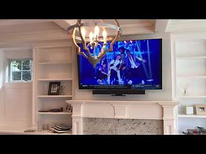 LG OLED Mounted on MantelMount MM540 above fireplace