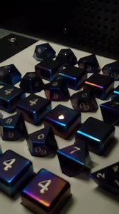 5.3K views · 443 reactions | The fact that laser engraving sounds like a slowly dieing robot or 90s dial up internet never ceases to humor me. Hot of those robot murdering lasers is our latest run of Titanium Dragon's Dice which are in-stock and ready for a gaming table near you. https://www.artisandice.com/order/titanium-dragons-dice/ | Artisan Dice | Facebook