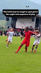 When is a hold an offense? And when is it trifling? What are the considerations? This one is difficult to see from the Referee’s position here, the arm just looks like it’s up and in normal contact as he’s running in the attack. That is until the attacker starts to pull and the defender is kept off the ball. This should be a holding offense. The hold is an extended one and it’s affecting the defender’s ability to move for the ball. The AR (if present) should ideally see that and raise his flag f