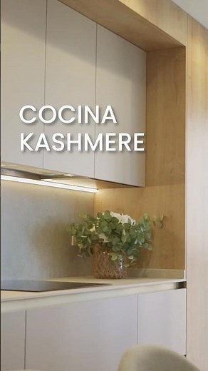 An open kitchen with an island and cashmere silk cabinets #kitchendesign