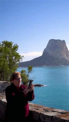 clip-3995002255-retired-woman-recording-video-phone