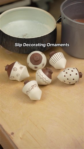 Since I work in a dark clay body, I love dipping my pots in porcelain slip to create a nice contrast. These ornaments just seemed to need a little carving to make them extra special on the tree. The wire being added at the end is a high temperature wire that can be fired in the kiln. This has the added benefit of being ready to hang straight out of the glaze firing. It does create a complication of how to fire the piece once glaze is on it, but I will be making some wadding to hold this piece ri