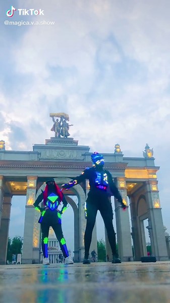 Futuristic Dance Performance in Neon Costumes