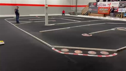 Get ready for action in the Christmas race, the 21.5TC A main racing is heating up fast! Don't even think about blinking or you'll miss the Xray T4, the green car, as it zooms past with a strong early showing! But little did you know, the driver had other plans 😑 | Phoenix RC Raceway