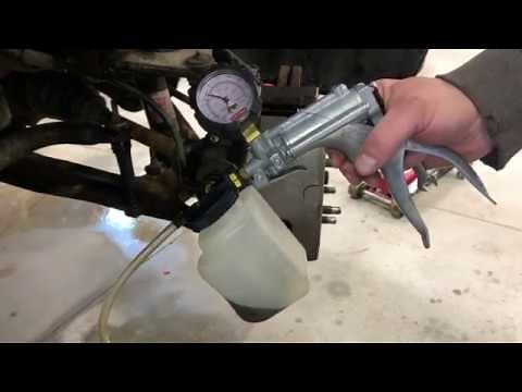 Bleeding brakes with a vacuum pump by yourself.