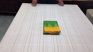 Sarangi Handwoven Kanjivaram Silk Sari - 1123303GRE Price : ₹ 14,890.00 INR ~~~~~~~~ This sari borrows its colours from juicy, ripe mangoes dangling on a leafy, laden tree. The leafy green body is seared with tiny checks in mango yellow, trimmed with temple motifs in kairi green on both ends and a luscious mango yellow double-sided border. Streaks of wood brown create slender stripes across the tempting mango yellow pallu. Shop this sari: http://amp.gs/dN3j ~~~~~~~~ Buy this saree online: ★ Free