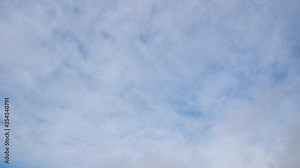 Beautiful white clouds time lapse against blue sky. Clouds moving away from camera.