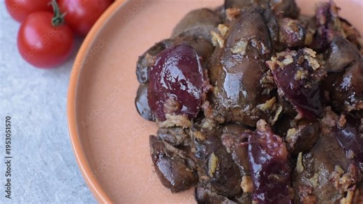 Chicken, duck, or goose liver with plums, onions, and spices. Chicken liver as a food background for your design