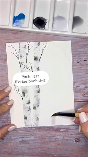 Jen Sweeney | Watercolor Artist • Instructor on Instagram: "And just like that you have a birch tree. The scoop 👇🏼 • Use any pigment of blue, black, and very light grey • I'm using a wedge brush (any size will do) on Canson XL Watercolor paper (100% cotton paper would actually be better for the best bleeds) • with a barely-there grey wash, start at the bottom of the paper with the wedge portion facing down. Quickly run your brush up the page. If you find that your brush fizzles out by the time