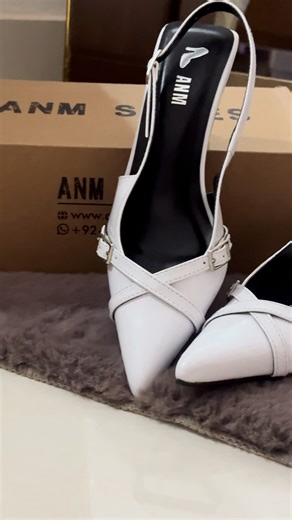 ANM on Instagram: "Sharp silhouette, glossy finish — white heels that speak elegance"