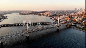 Drone shot of the Golden Horn Bridge in Istanbul. Cable-stayed bridge in Istanbul. A narrow curved bay that flows into the Bosphorus at its junction with the Sea of ​​Marmara. Metro line in Istanbul.