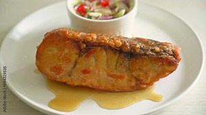 fried snapper fish with fish sauce and spicy salad - Asian food style