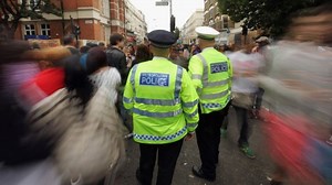 Police officers dance at Carnival
