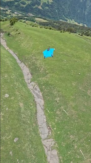 Wingsuit Flying Over Swiss Alpine Meadows