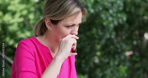Nasal drops and pollen allergies in spring and summer. Woman using nasal spray