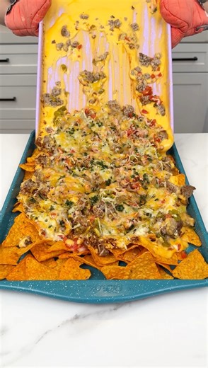 My Favorite Nacho Recipe I make dorito nachos using cheddar cheese. | Justine Kameron