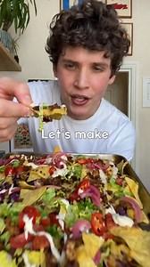 These LOADED VEGAN NACHOS by Max AKA @maxlamanna are a total game-changer! 😍🤤 Piled high with plant-based goodness, these nachos have everything from a creamy vegan “cheese” sauce to a delicious tofu “ground beef” and tangy pickled red onions. It’s the ultimate snack or meal that’ll have you drooling! 🙌⁠ PRO TIP! Warm them in the oven for a couple of minutes before adding the fresh toppings to take them to the next level.⁠ 😋 Recipe below ⬇️ —don’t forget to save this post for your next nacho