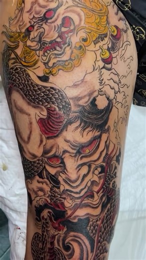 DS Tattoo Studio on Instagram: "Japanese symbolism in motion. The mask represents inner strength and control. The Fu Dog stands for protection and balance. Thank you, cordially for the trust @vasilsavovv 🙌 #kwadron #tattooartist #japanesetattoo #tattoodesign #tattoo"