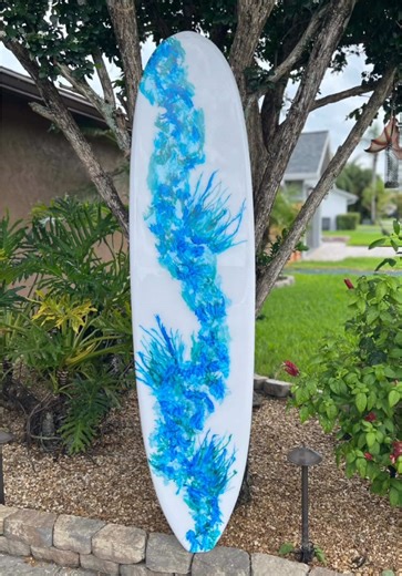Surfboard art for a coastal interior by Tiki Soul. #beachdecor #beachhouse #surfboardart #coastalwallart #surfdecor #moderncoastalstyle #tikisoulsurfboards