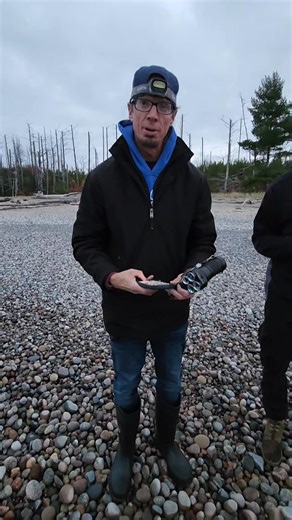 Doug finding a Yooperlite stone North of Newberry Michigan on Lake Superior using his AURORA uv flashlight from www.yooperlites.com Yooperlites are a Nephaline Syenite rich in fluorescent Sodalite brought down by glacial activity from the Coldwell complex in Ontario Canada and we use longwave uv flashlights from www.yooperlites.com to find these glowing rocks. #yooperlitehunting101 #yooperlites #ConvoyC8 #lakesuperior #yooper #minerals #Michigan #minecraft #rocks #glow | Yooperlites