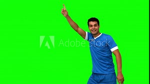 Upset football player disagreeing with the referee on green s