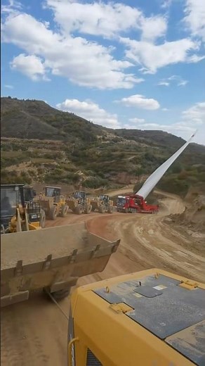 How are wind turbine blades transported up a mountain?