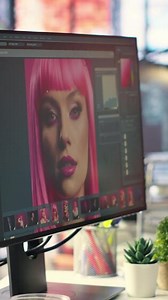 Vertical Organized creative workspace for graphic designers and photographers, featuring a dual monitor setup with digital editing tools. Photo editor software and AI chat bot for content creation.