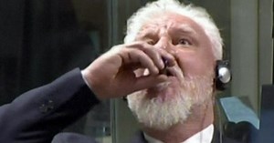 Convicted war criminal drinks deadly poison in court