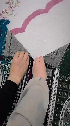 Folding a Prayer Mat with Intricate Designs