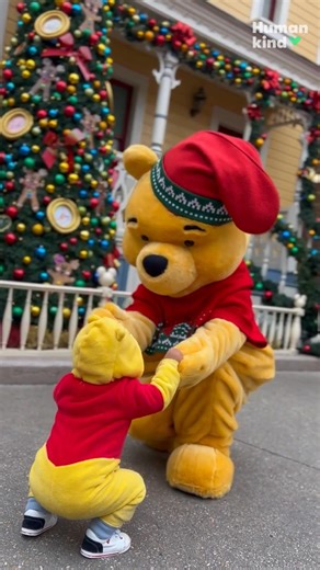 When Winnie the Pooh meets his tiniest fan...heart melted! 🎁🧸 #humankind #disney | USA TODAY