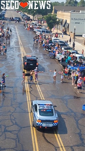 Colorado State Patrol Mustang Cruiser gets a Free Wash in the La Junta 4th of July Wet & Dry Parade