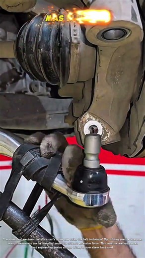 Professional mechanic installs car lower control arm using belt technique