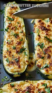 Zucchini sliced lengthwise. Sprinkle Italian seasoning, salt, pepper. Roast at 425°F for 15–18 minutes. These zucchini steaks turn buttery, tender, and topped with golden, melty cheese. Ingredients ➤ 3 large zucchinis, halved lengthwise ➤ 2 tbsp olive oil ➤ 2 tbsp unsalted butter, melted ➤ 3 garlic cloves, minced ➤ 1/2 tsp Italian seasoning ➤ Salt & black pepper, to taste ➤ 1 cup shredded mozzarella ➤ 1/4 cup grated Parmesan FULLL Recipe in First Cօʍʍеոτ 👇👇 | Nessy Recipes