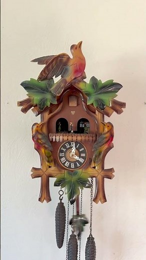 Colorful 1960s vintage Leaf & Loon style musical cuckoo clock. Made in Germany by E Schmeckenbecher.