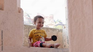 innocent child cute facial expression at outdoors at morning from flat angle