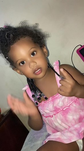 Joyful Child in Pink Dress Expresses Happiness