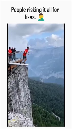 Laugh Blast | Scare pranks on Instagram: "The post features a 62-second video compilation of edited or AI-generated extreme stunts, such as cliff jumps into inflatable pools and wingsuit flights, captioned to mock social media's drive for viral attention through reckless content. Replies predominantly label the video as "AI slop," noting visual inconsistencies like morphing figures and impossible physics, highlighting growing skepticism toward hyper-realistic digital fakes in 2025's content land