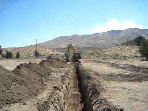 Digging a Trench with a CAT 315 Excavator by James Mulgrew