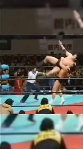 Riki Choshu, in a near-death state, delivers a back drop to Jumbo Tsuruta, while Yoshiaki Yatsu e...