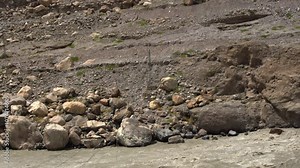 Hunza Valley river, rocky stone boulders nature landscape Pakistan South Asia