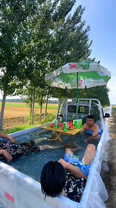 32K views · 1.1K reactions | Can you believe that a pickup truck is used as a swimming pool? Four guys in Heze, a city in east China’s Shandong Province, make it possible. They stop their pickup truck next to golden cornfields and fill the vehicle with water, creating a joyful experience with iced watermelons and beverages. #pickup #pickuptruck #swimmingpool #summertime #summervibes #watermelon #diversifiedchina Courtesy of Douyin 1753562928 | CGTN China24 | Facebook