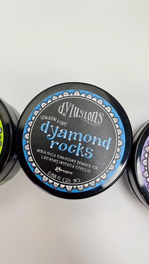 Adding Glamour and Glitter to @dyanreaveley Dylusions Dyamond Boards with Dyamond Rocks and Dust ✨ In case you missed it, here’s a slowed-down tutorial on infusing some dazzling magic into your Dyamond Boards. 💎💫 Supplies:🔹Dylusions Dyamond Boards: Hexagons🔹Dylusions Dyamond Medium🔹Dylusions Dyamond Rocks: London Blue🔹Dylusions Dyamond Dust: Pink Flamingo🔹Ranger Heat It ™Craft Tool🔹Dylusions by Stampers Anonymous Stamps: Build a Quilt🔹Dylusions Dyamond Medium Pad🔹Dylusions Dyamond Brus
