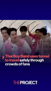 Thai boy band, 'Proxie', uses a tent on wheels to travel through an airport safely and avoid being mobbed by fans. | The Project