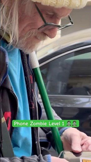 Elderly man gets a friendly Level 1 Phone Zombie violation for mild phone distraction in public