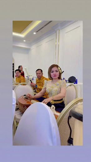 Traditional Music Performance with Elegant Attire